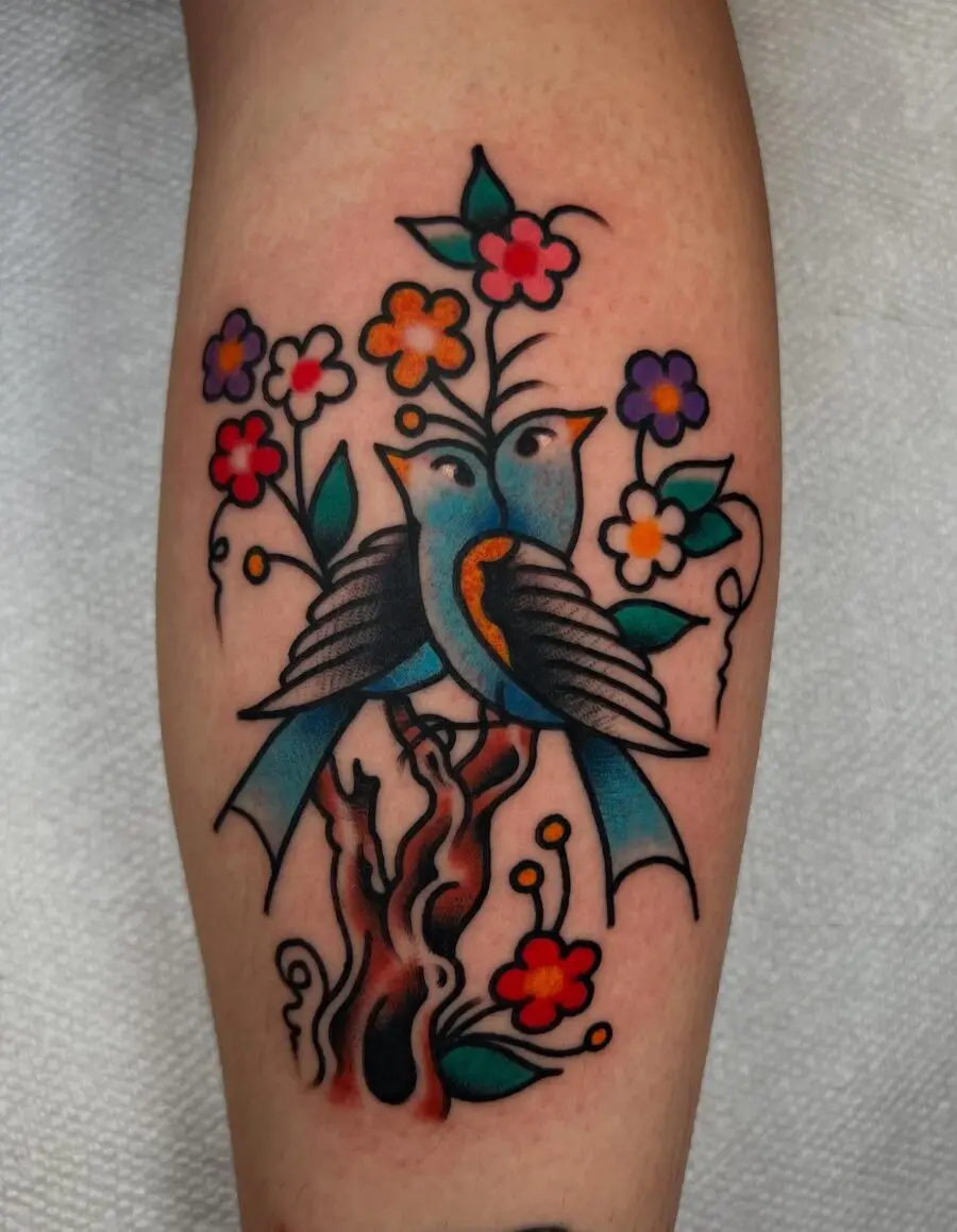 Vibrant Americana Tattoo with Birds and Flowers