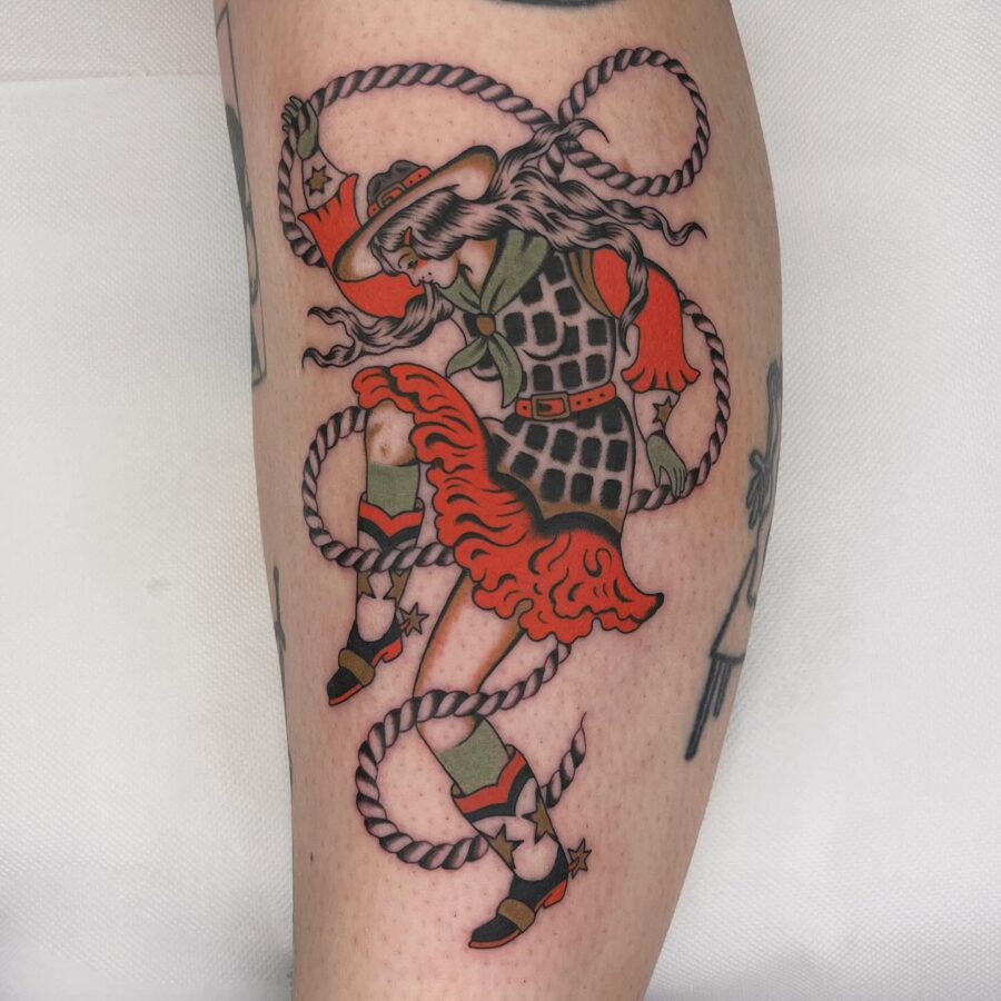 Colorful Americana tattoo featuring a dancing cowgirl