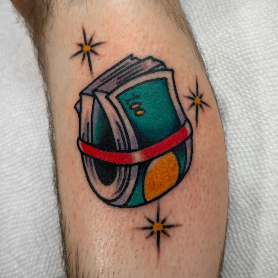 Colorful tattoo featuring bundles of cash