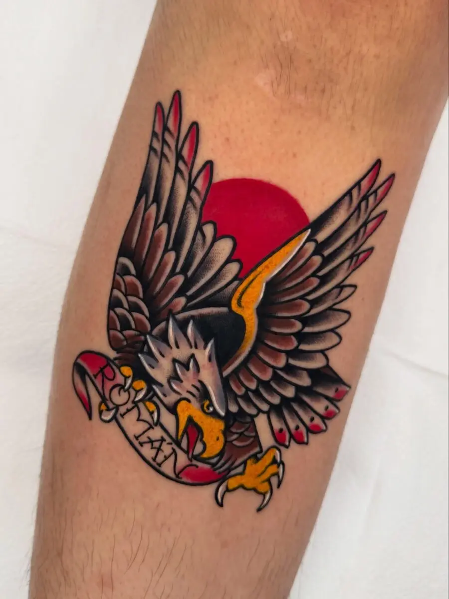 Vibrant eagle tattoo with sunset background