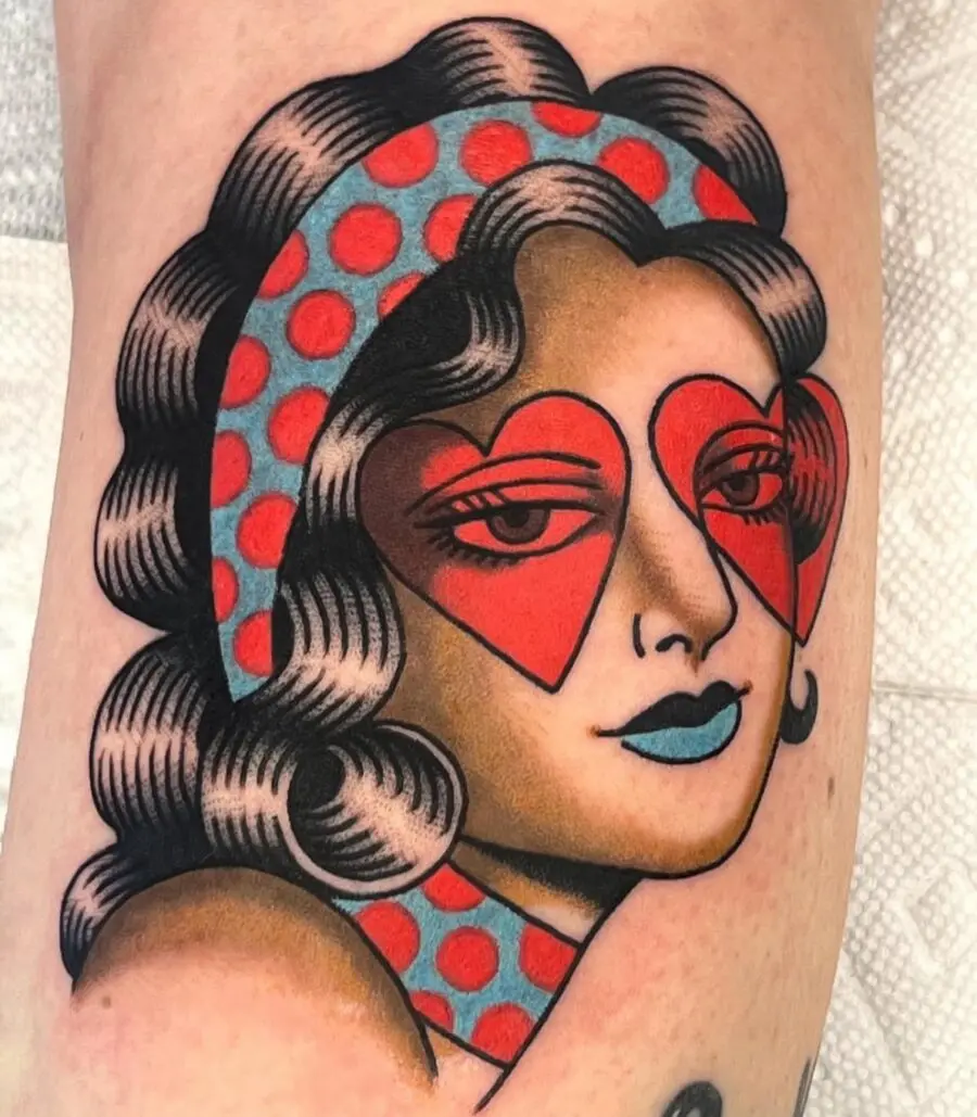 Retro-inspired Americana tattoo with heart motifs