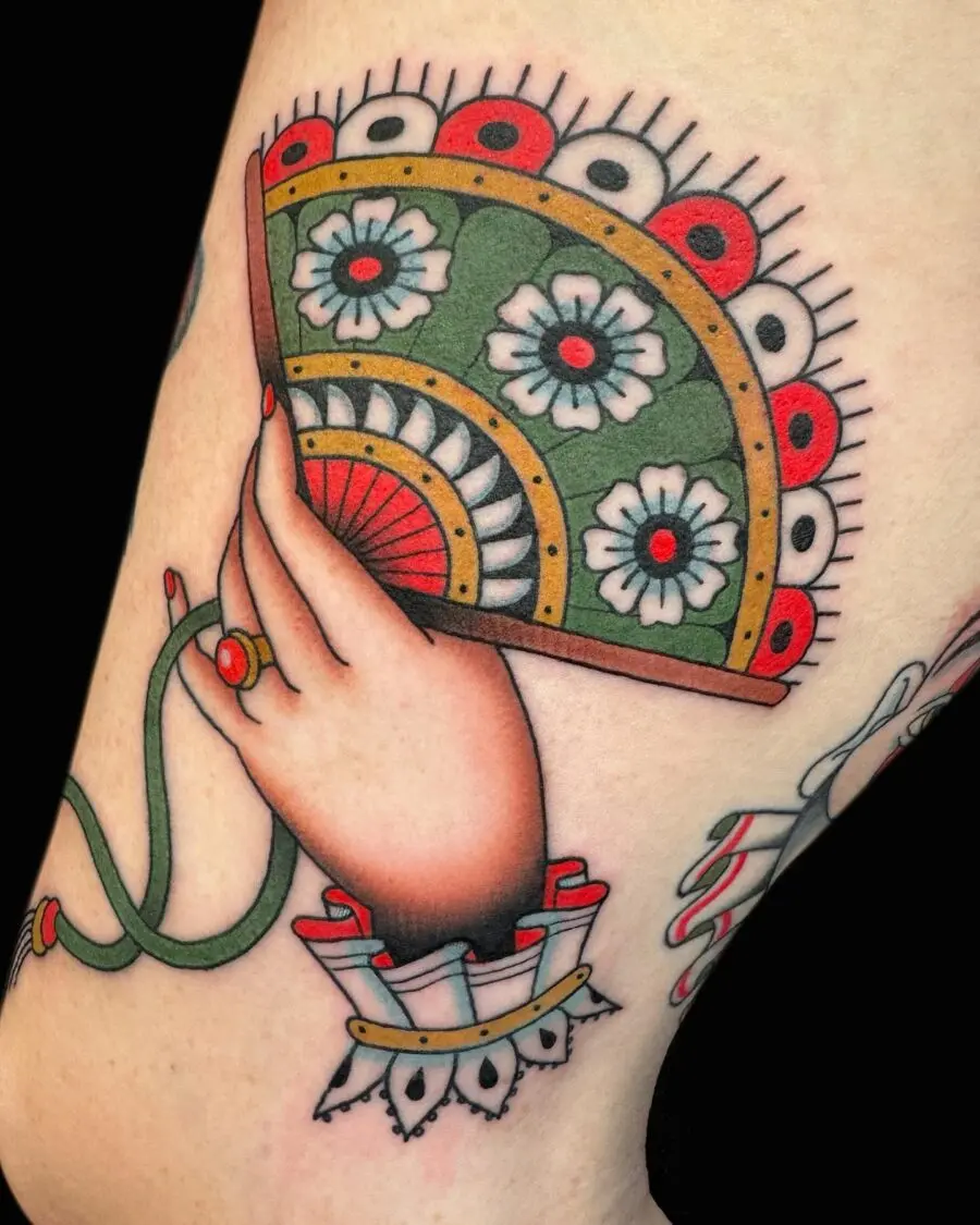 Colorful hand fan tattoo with floral designs