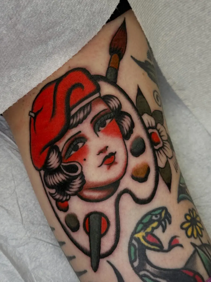 Colorful palette girl tattoo showcasing artistic spirit