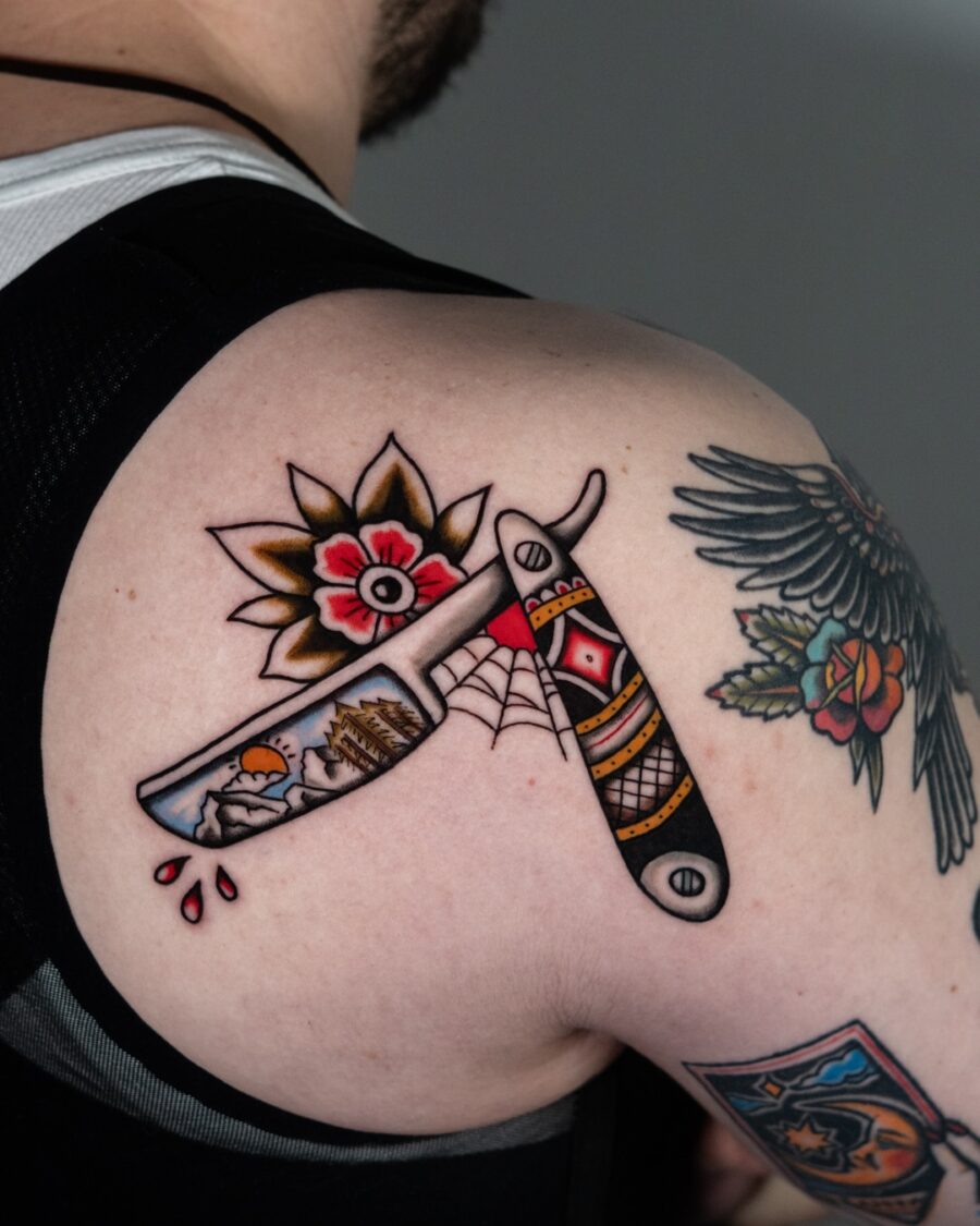 Bold Americana tattoo with razor and flowers