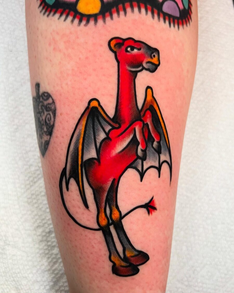 Bold red dragon tattoo with playful vibes