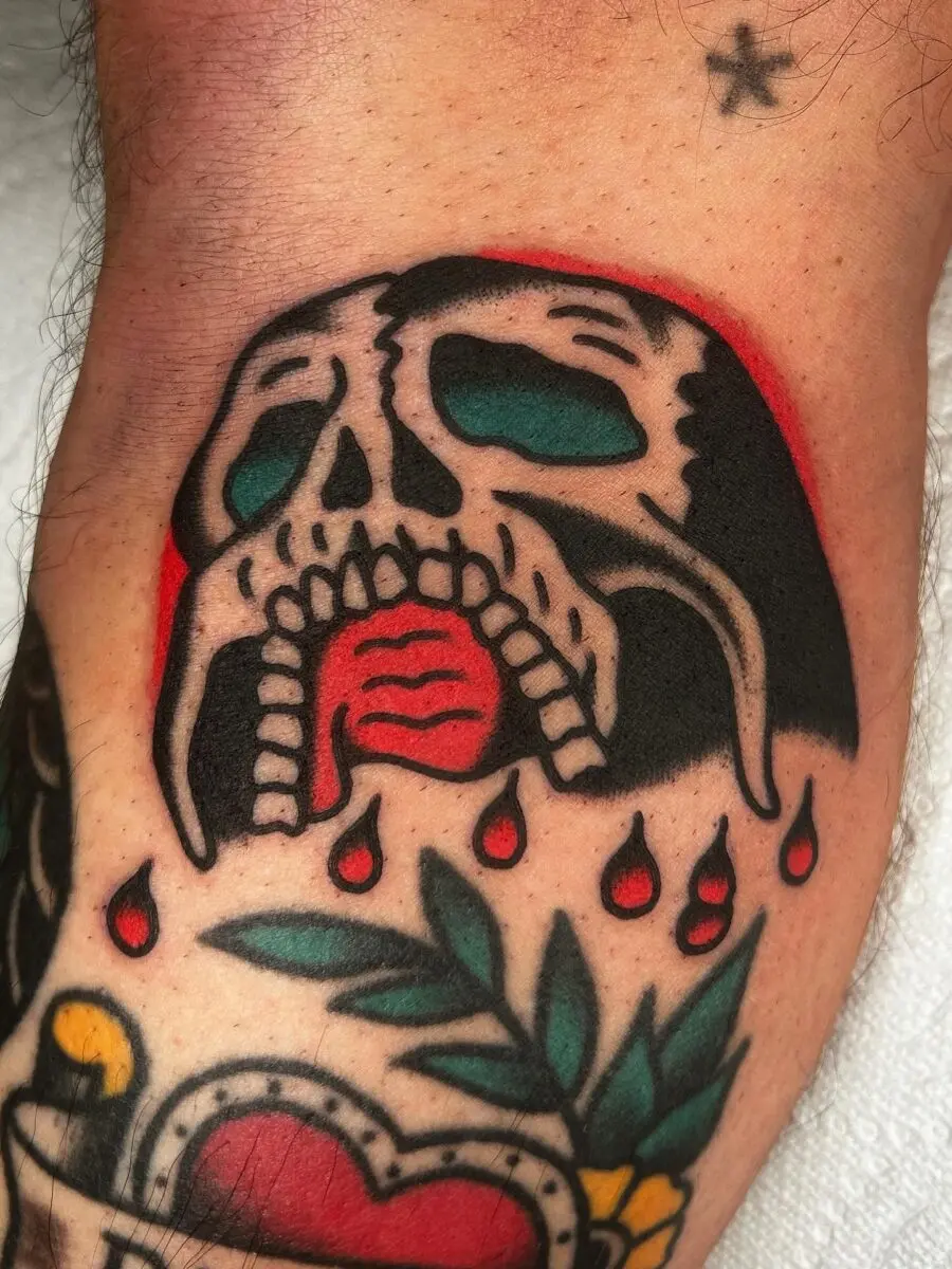 Bold skull tattoo with dripping details