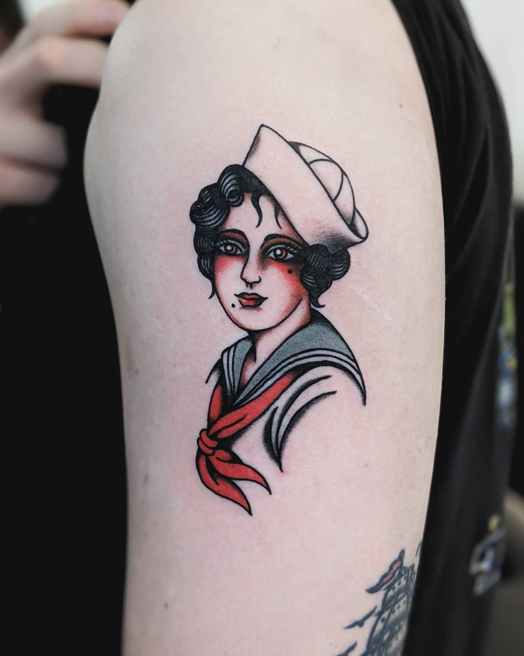 Vintage sailor girl tattoo with classic elements