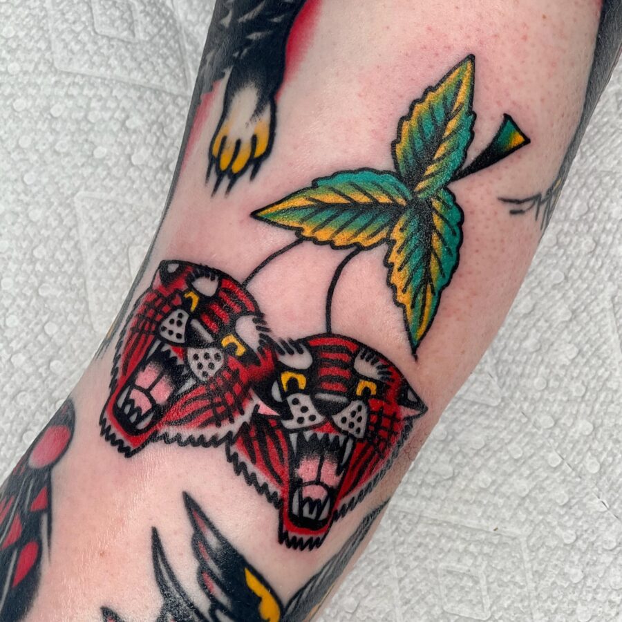 Bold Americana-inspired tattoo of roaring tigers