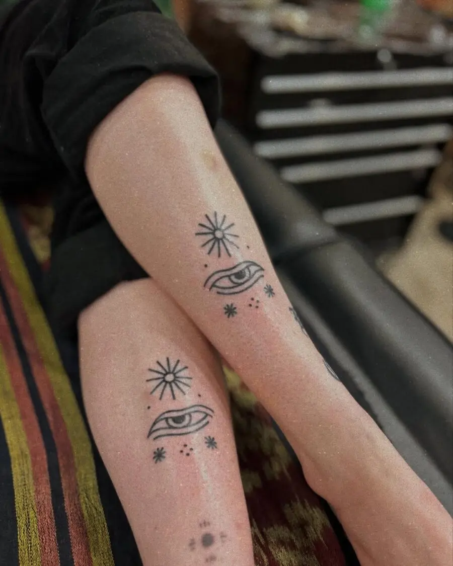 Mystical Eye Tattoos with Radiant Sun Motifs