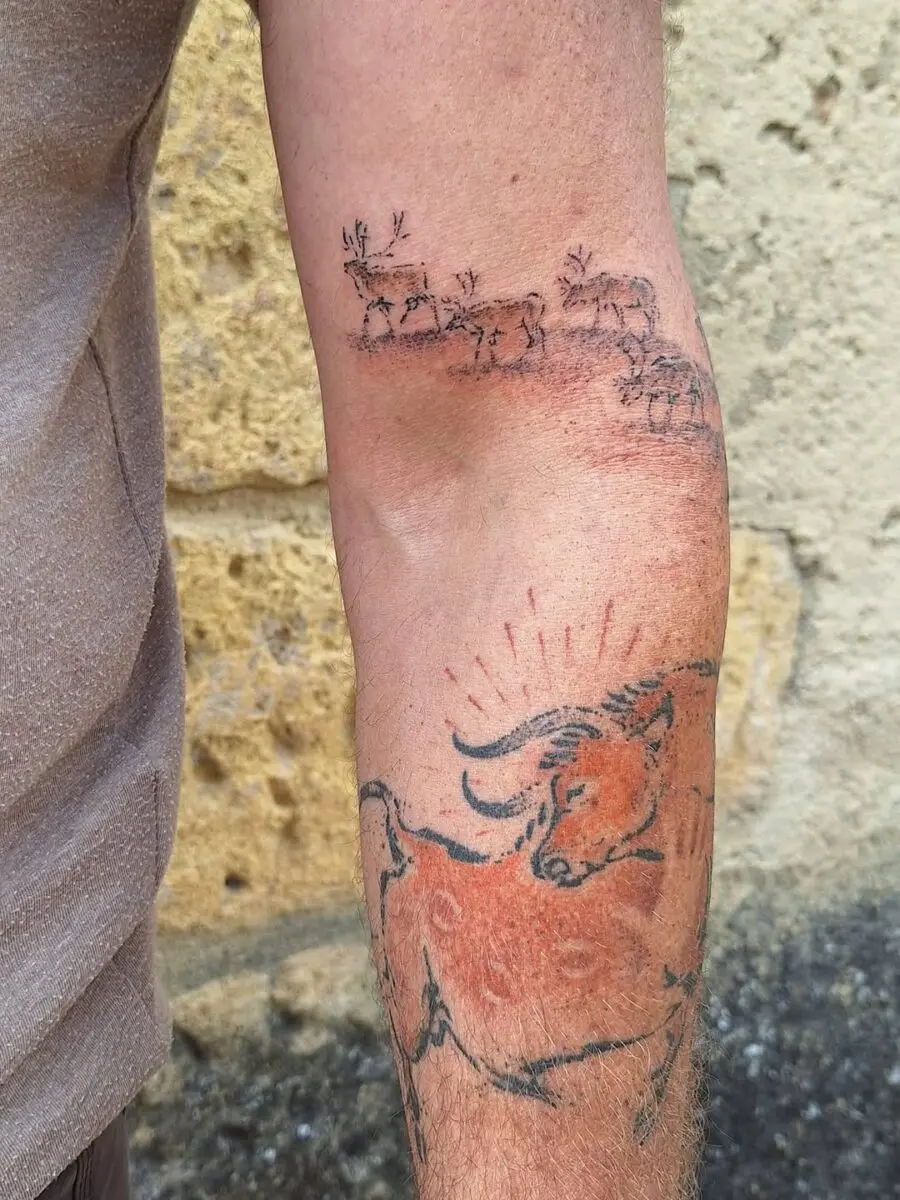 Captivating ancient bull tattoo design on arm