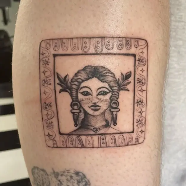 Intricate framed portrait tattoo work