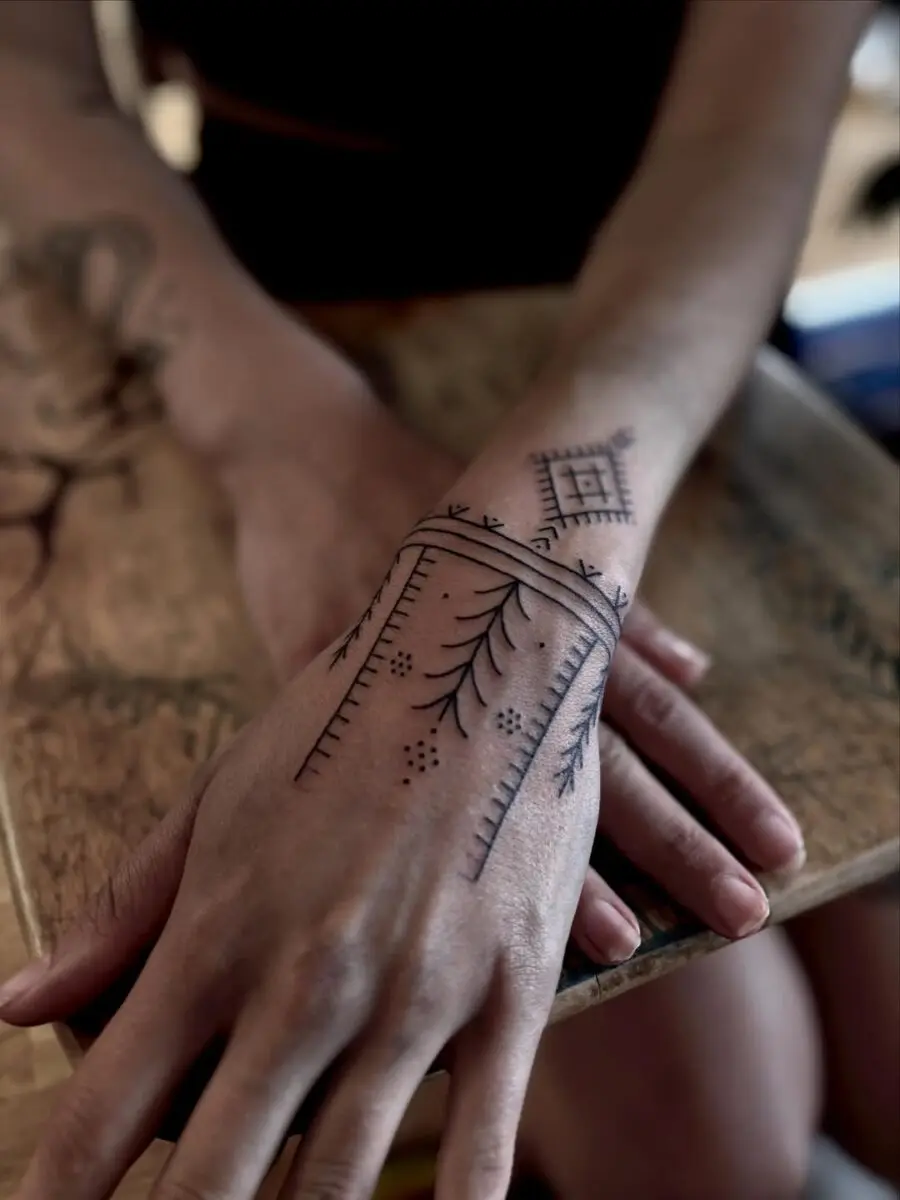 Elegant blend of geometry and nature in tattoos