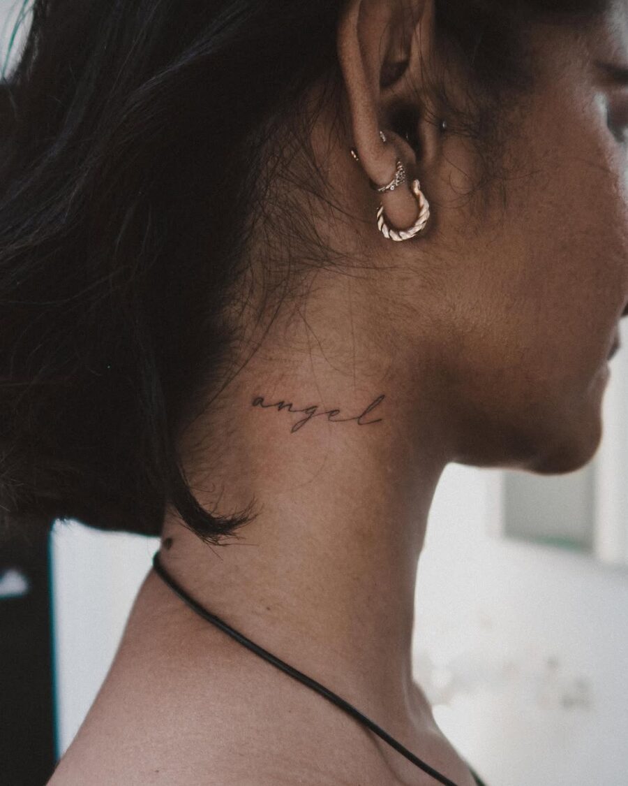 Elegant script tattoo with the word 'angel'