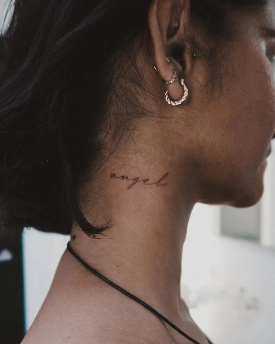 Elegant script tattoo with the word 'angel'