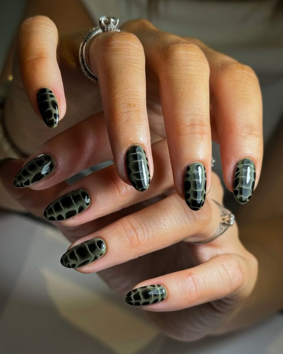 Stylish black and green animal print nails