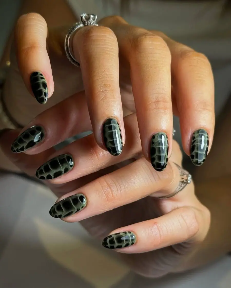 Stylish black and green animal print nails