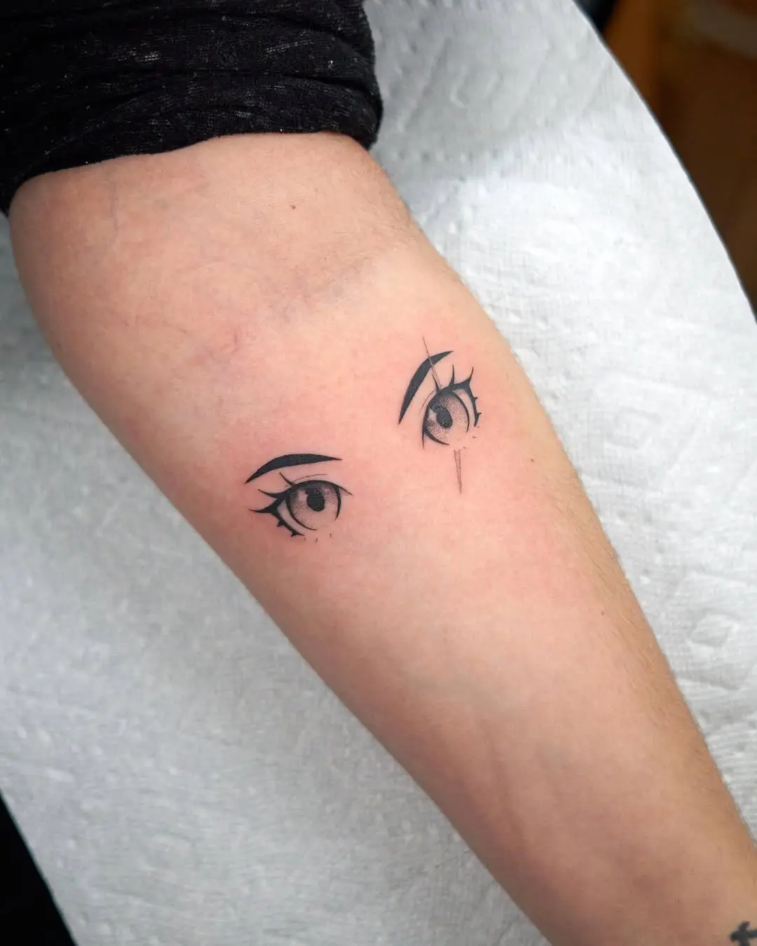 Minimalist anime eye tattoo for subtle expression
