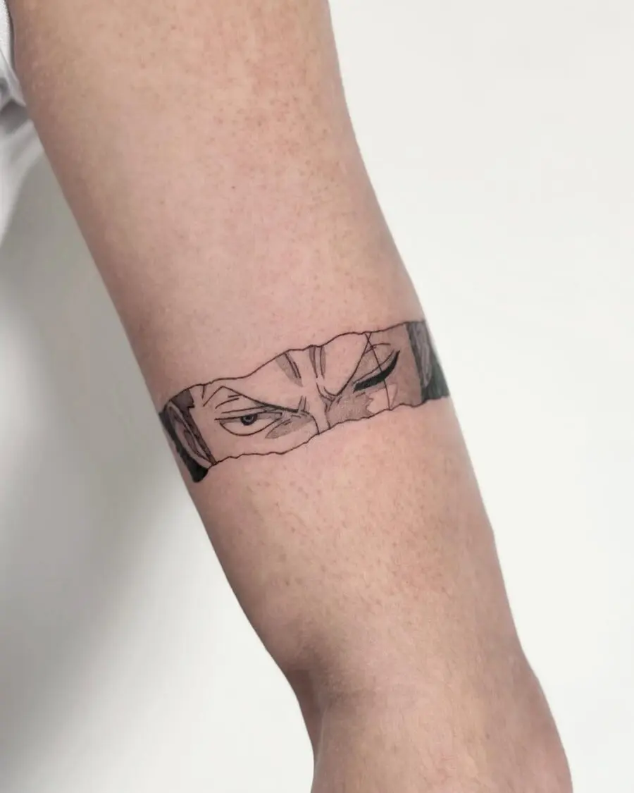 Striking anime eyes tattoo on the arm