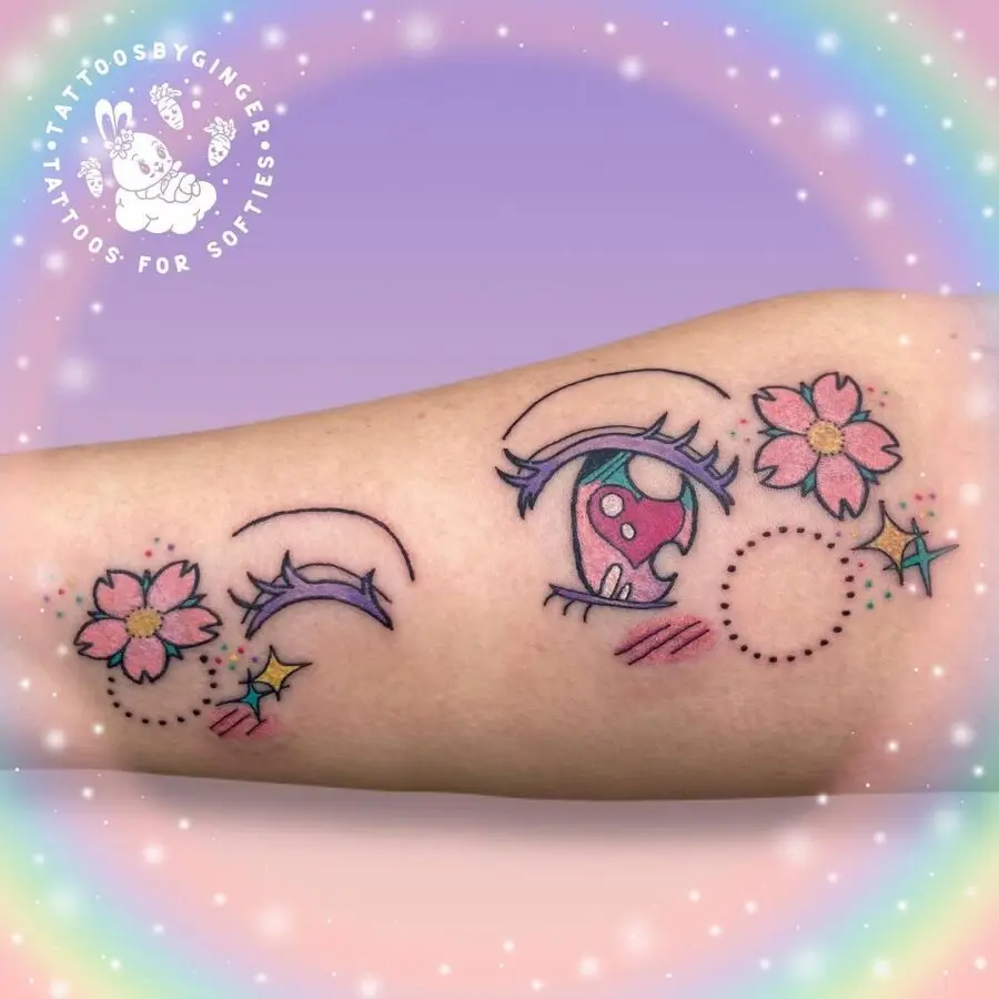 Vibrant anime-inspired eye tattoos with floral accents