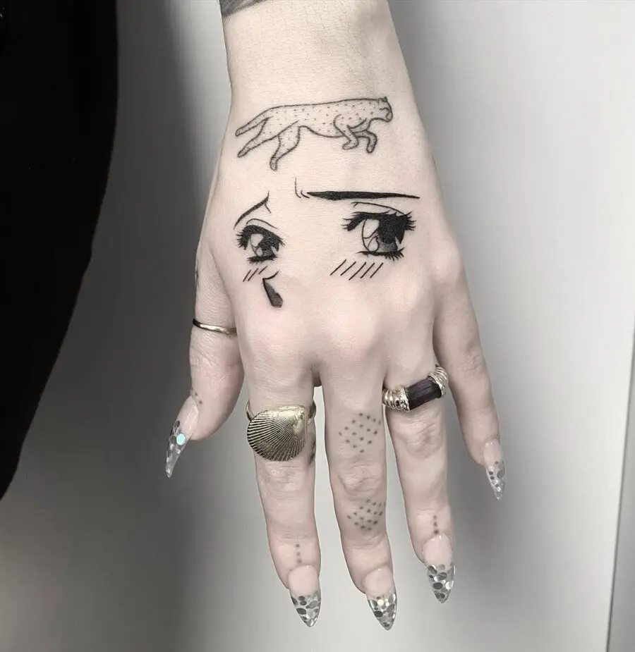 Unique anime eyes tattoo on hand