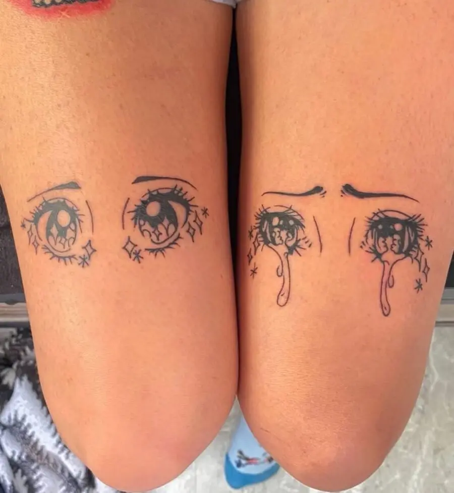 Charming anime-inspired eye tattoos on knees