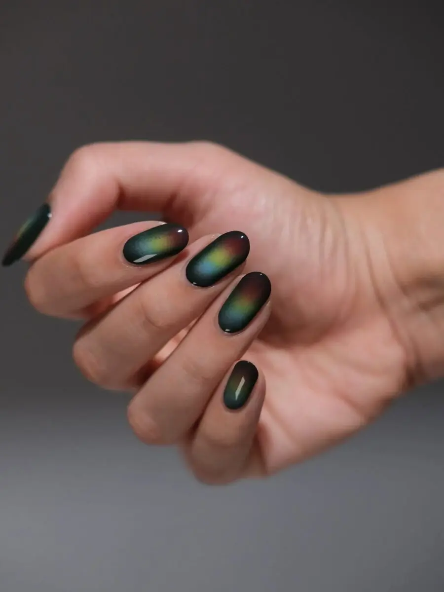 Stunning dark green aura nail design