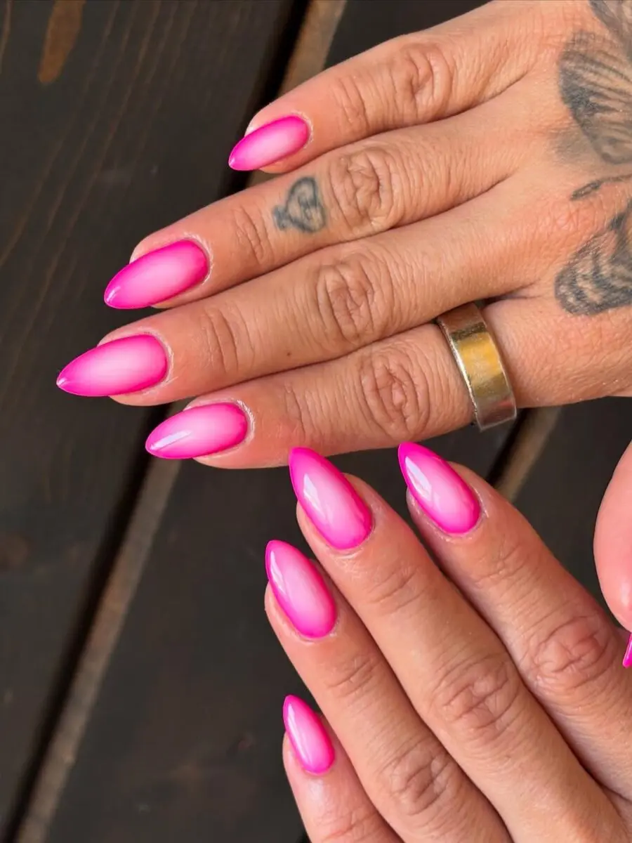 Stylish aura nails with a pink gradient