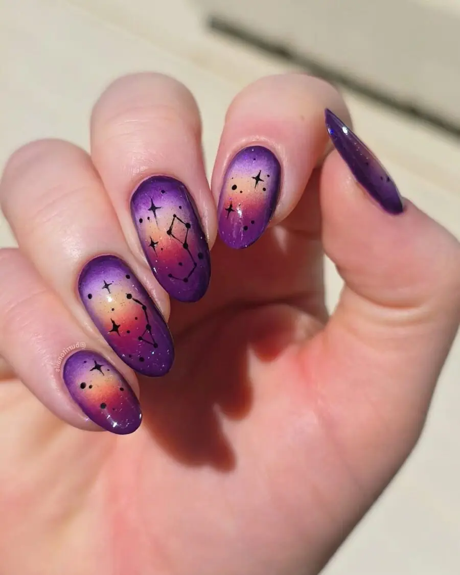 Vibrant galaxy-inspired aura nails with constellations
