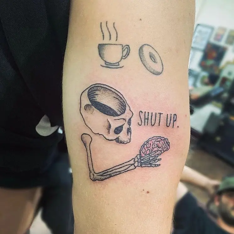 Unique skull and bagel tattoo design