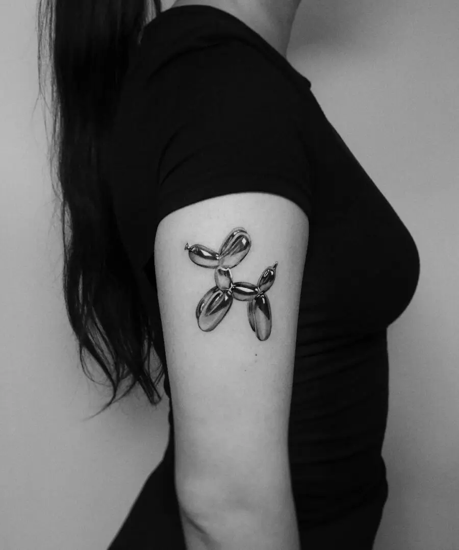Sleek black and gray balloon dog tattoo design
