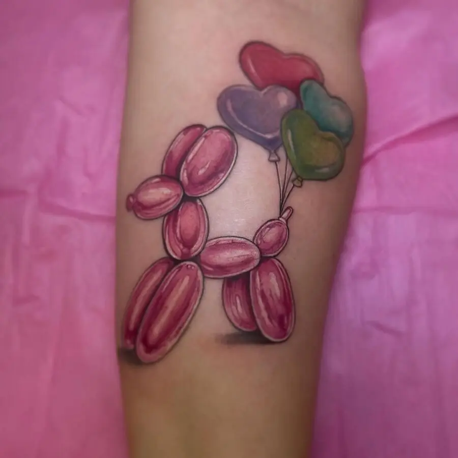 Playful balloon dog tattoo with vibrant balloons