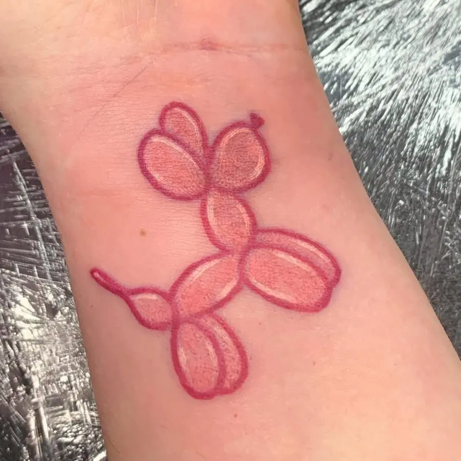Charming balloon dog tattoo with vibrant colors