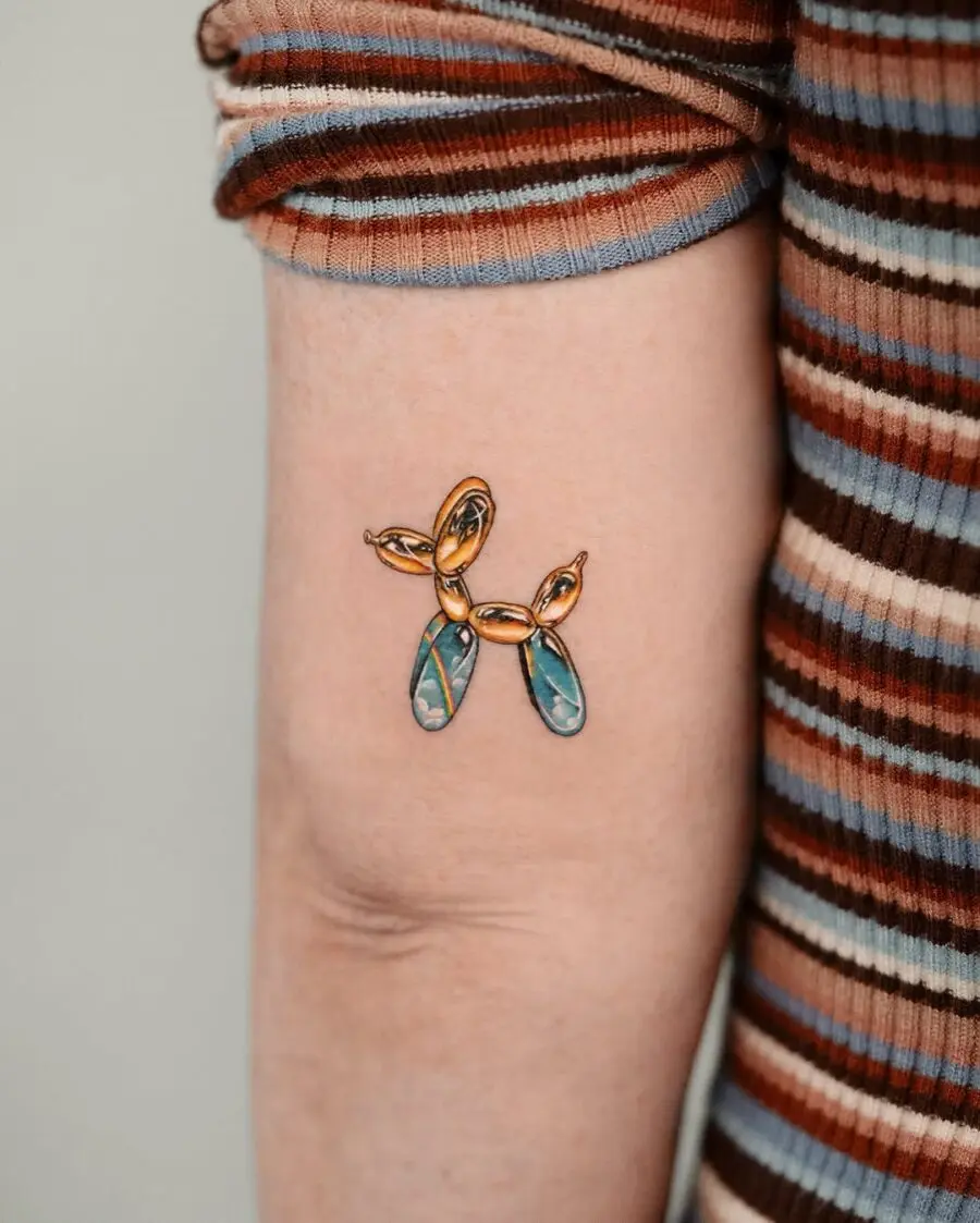 Colorful balloon dog tattoo with artistic flair