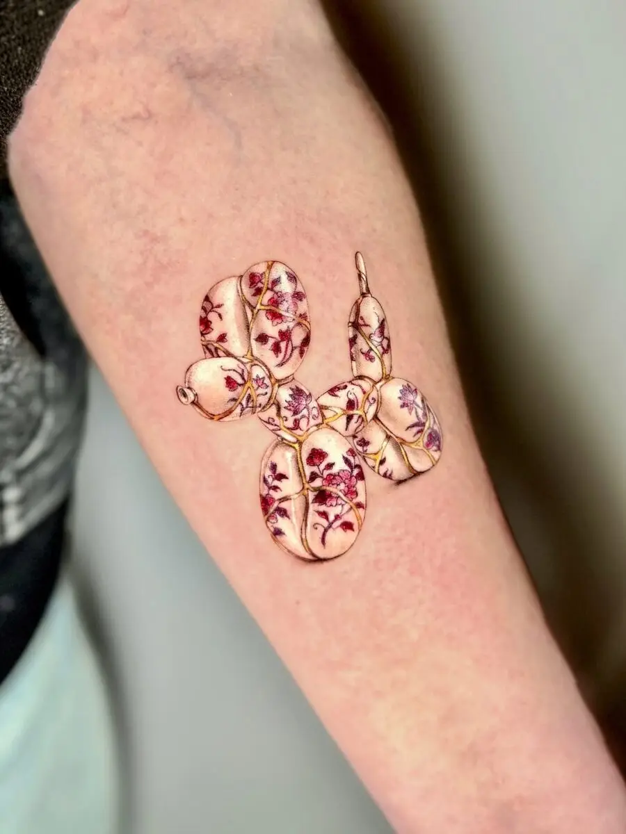 Whimsical Balloon Dog Tattoo with Floral Touch