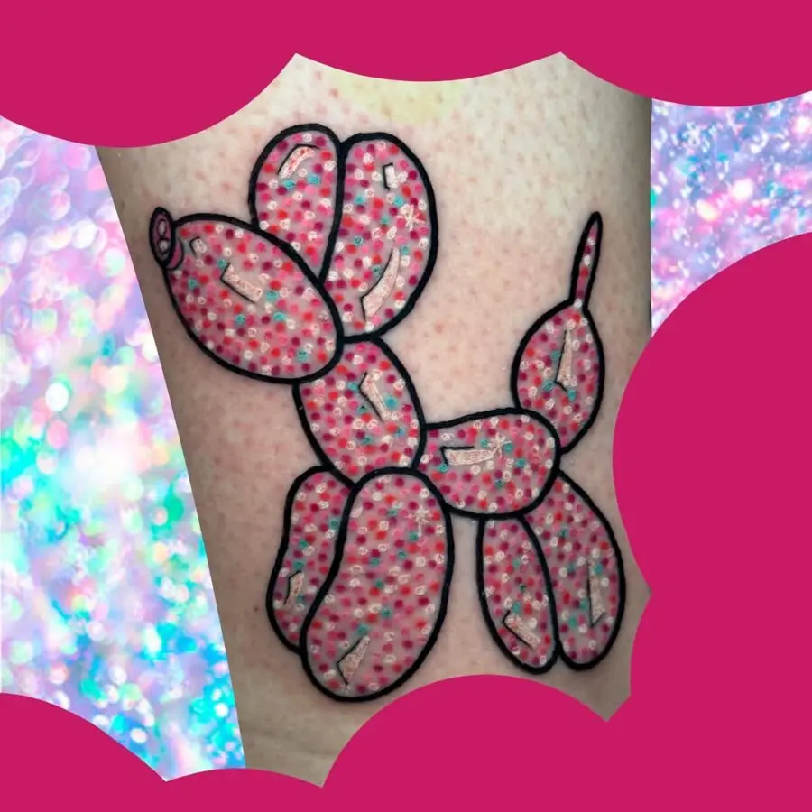 Bold and playful pink balloon dog tattoo design