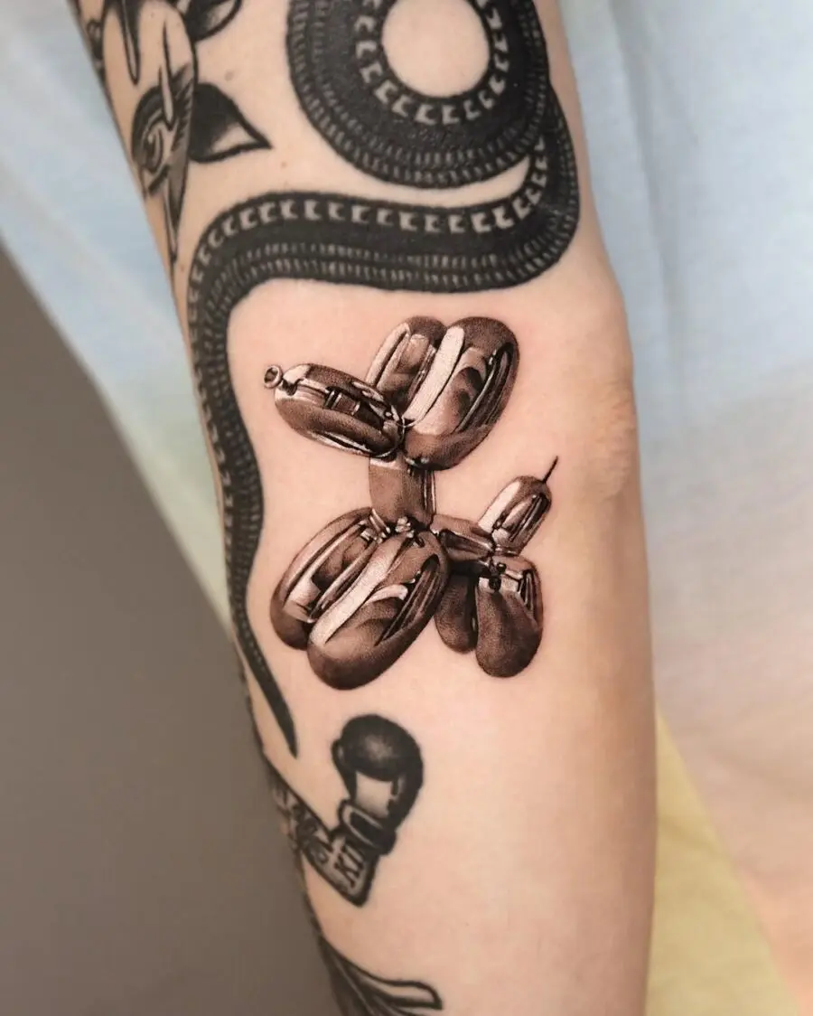 Realistic balloon dog tattoo on display