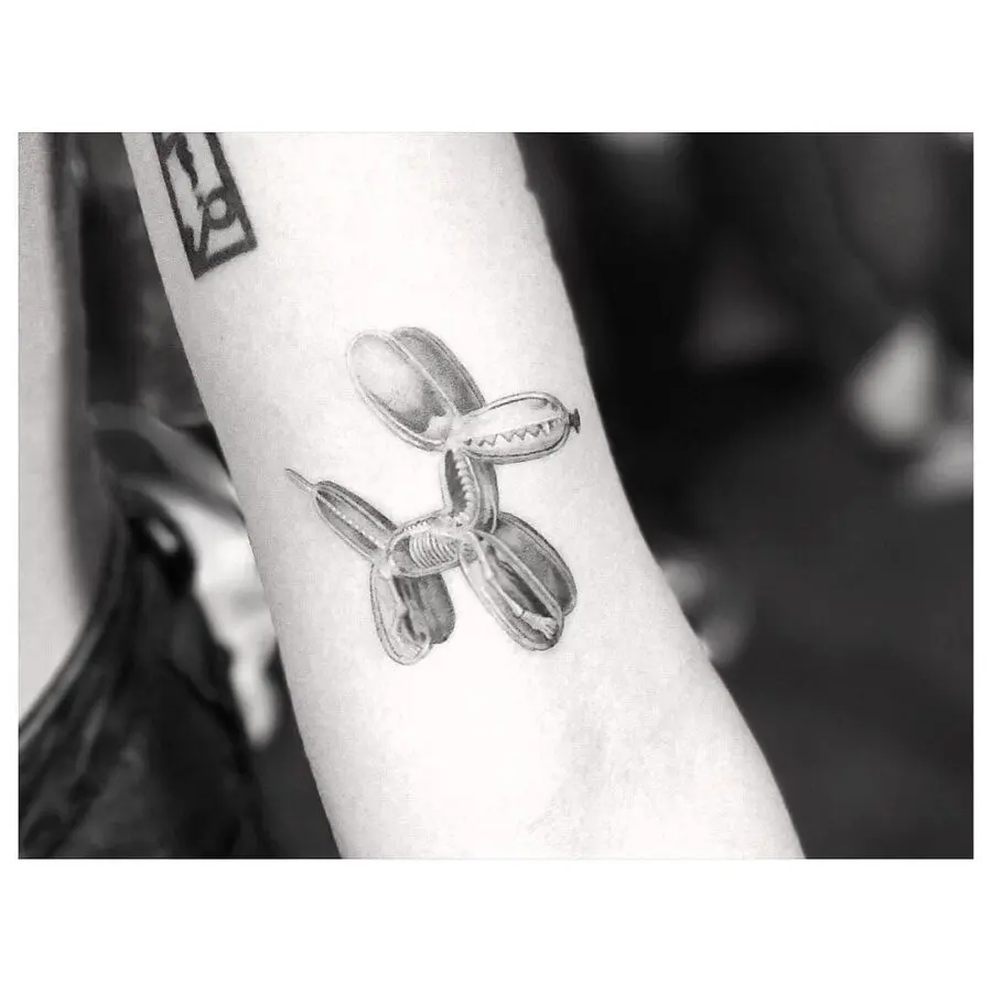 Stylish balloon dog tattoo with a playful vibe