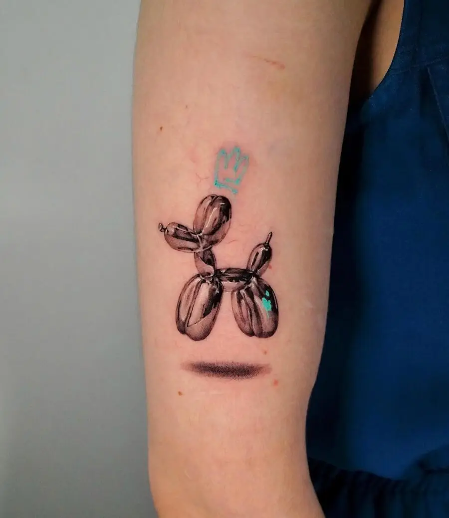 Playful Balloon Dog Tattoo with Crown Design