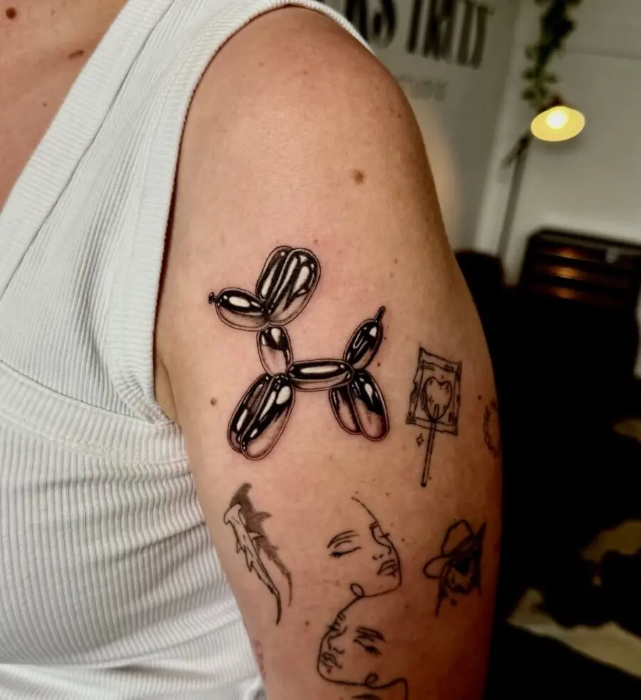 Charming minimalist balloon dog tattoo design