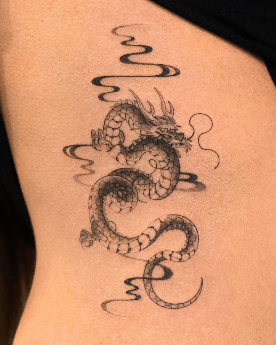 Stunning belly dragon tattoo with swirling clouds