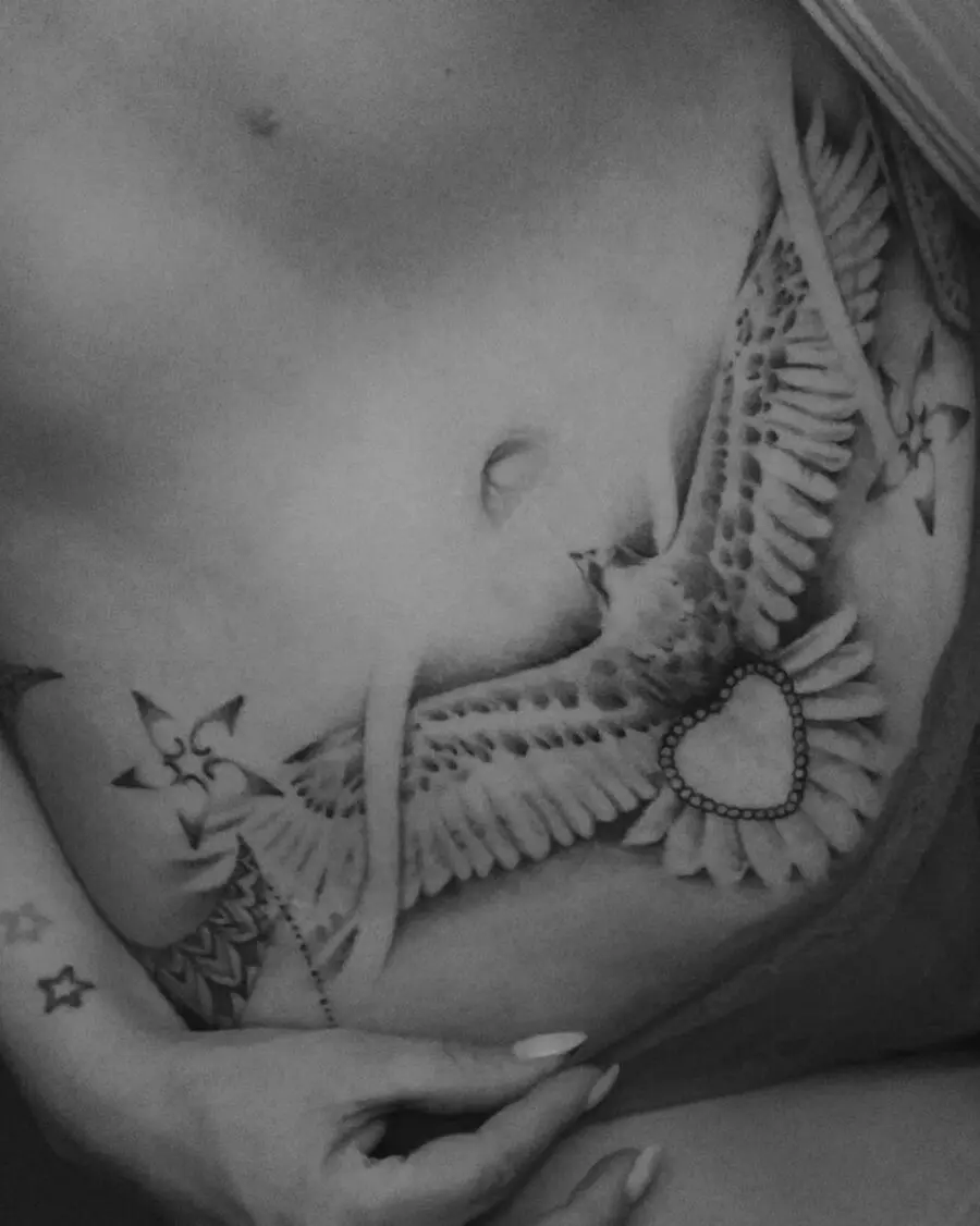 Elegant bird tattoo design on belly