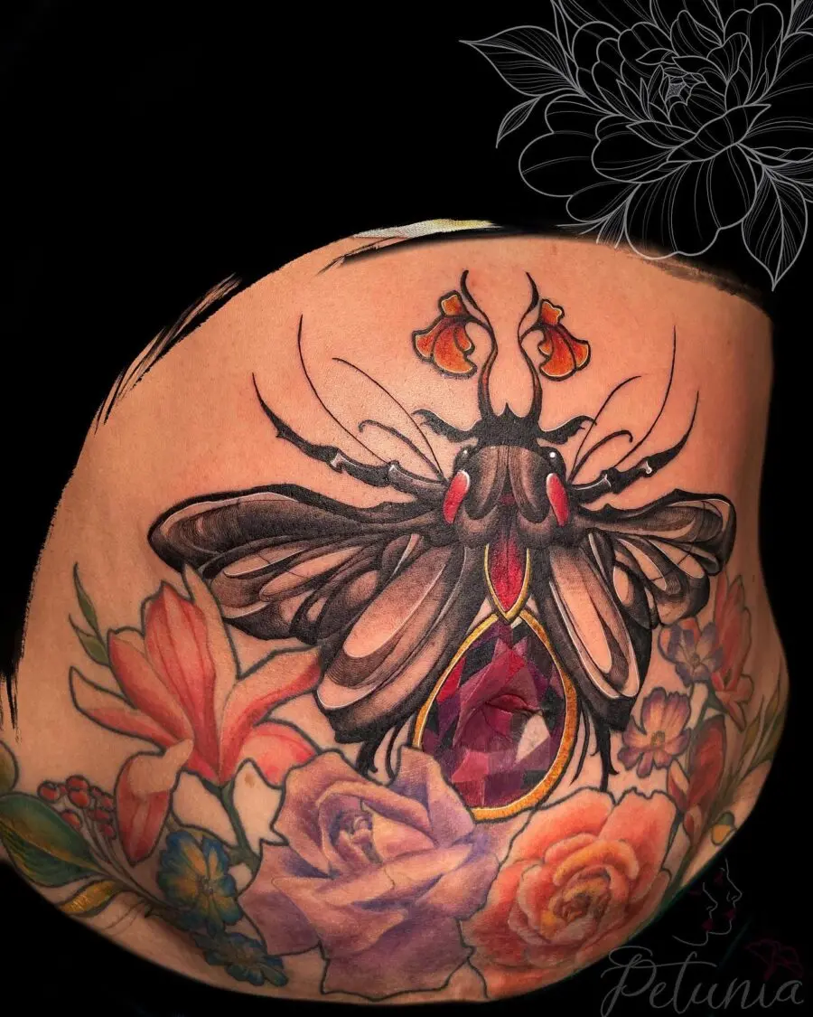 Stunning belly tattoo featuring a butterfly design