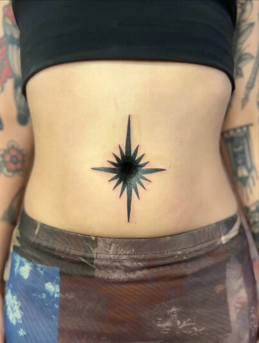 Striking Black Star Compass Belly Tattoo