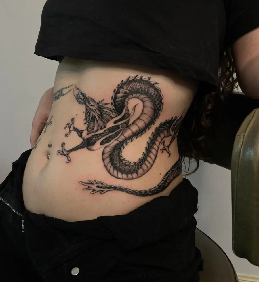 Intricate dragon belly tattoo showcases bold artistry