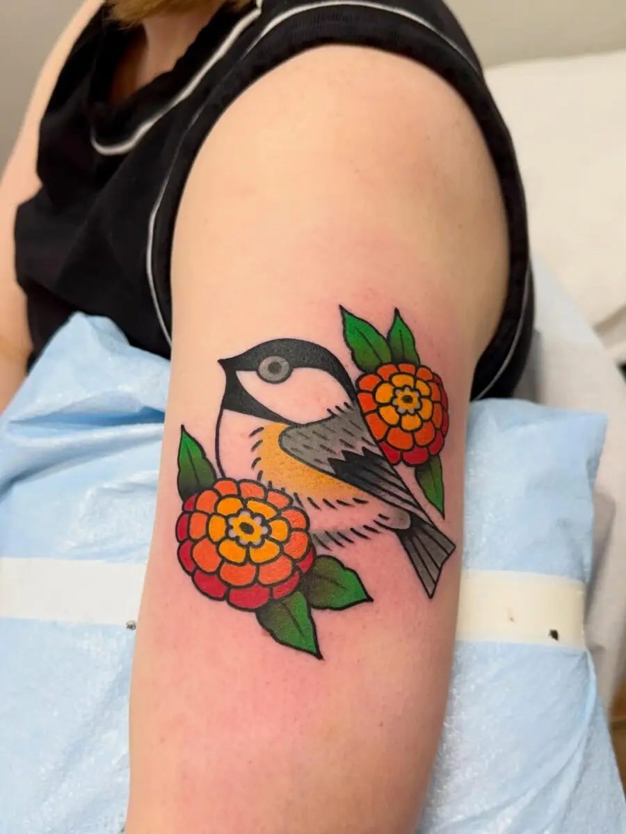 Bright Zinnia Tattoo with a Charming Bird