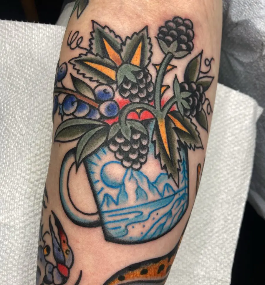 Vibrant Americana Mug Tattoo with Berries