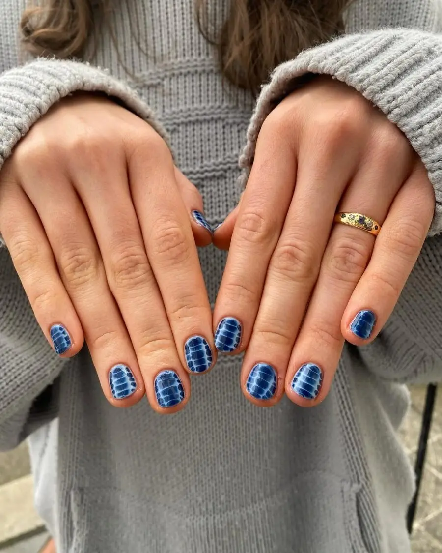 Chic blue animal print nail design showcased