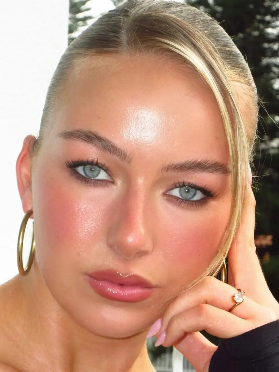 Glamorous makeup enhancing stunning blue eyes