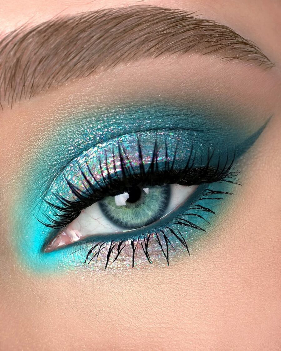 Vibrant teal hues highlight stunning blue eyes