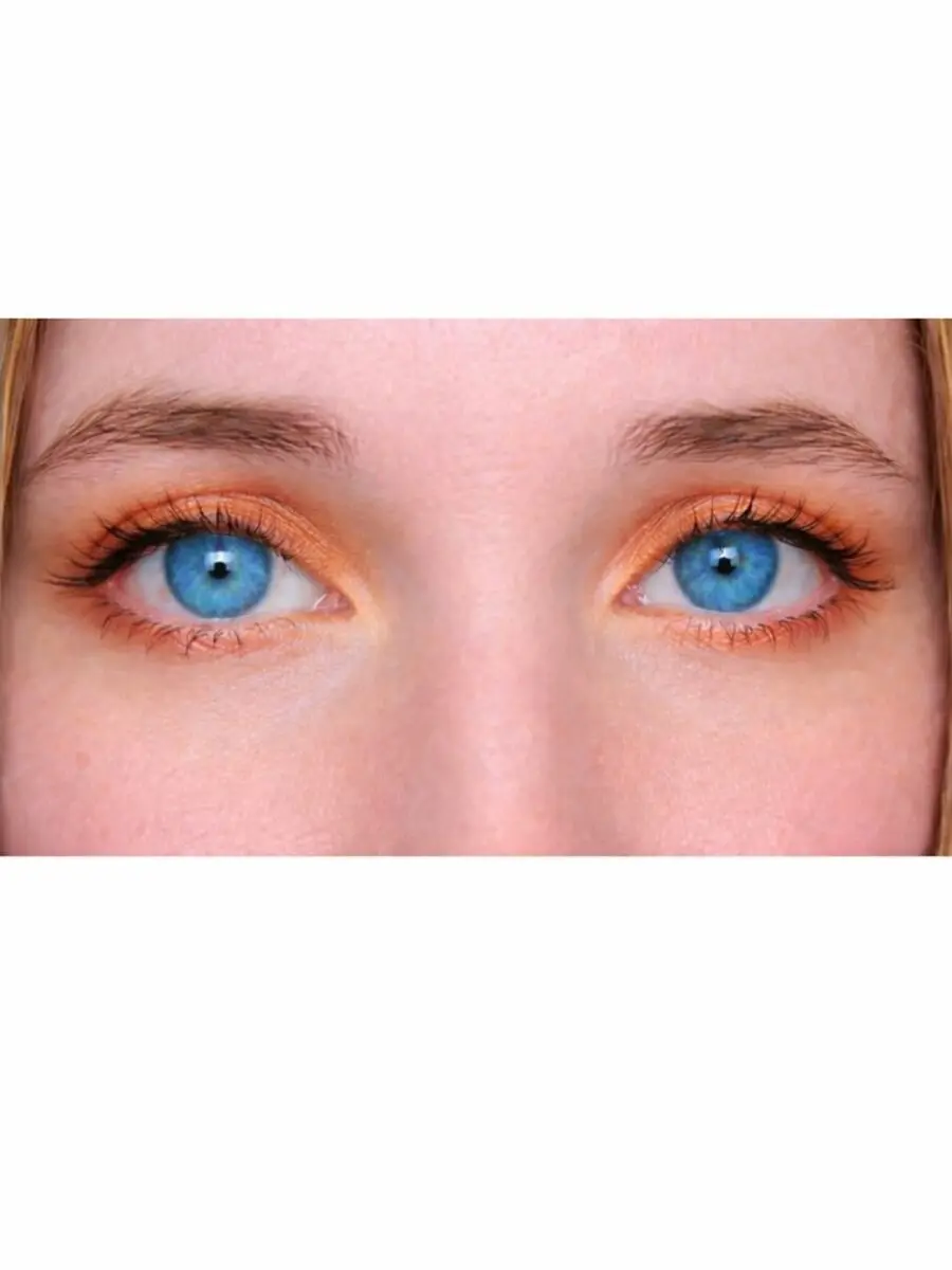 Vibrant Orange Shadow Enhances Blue Eyes